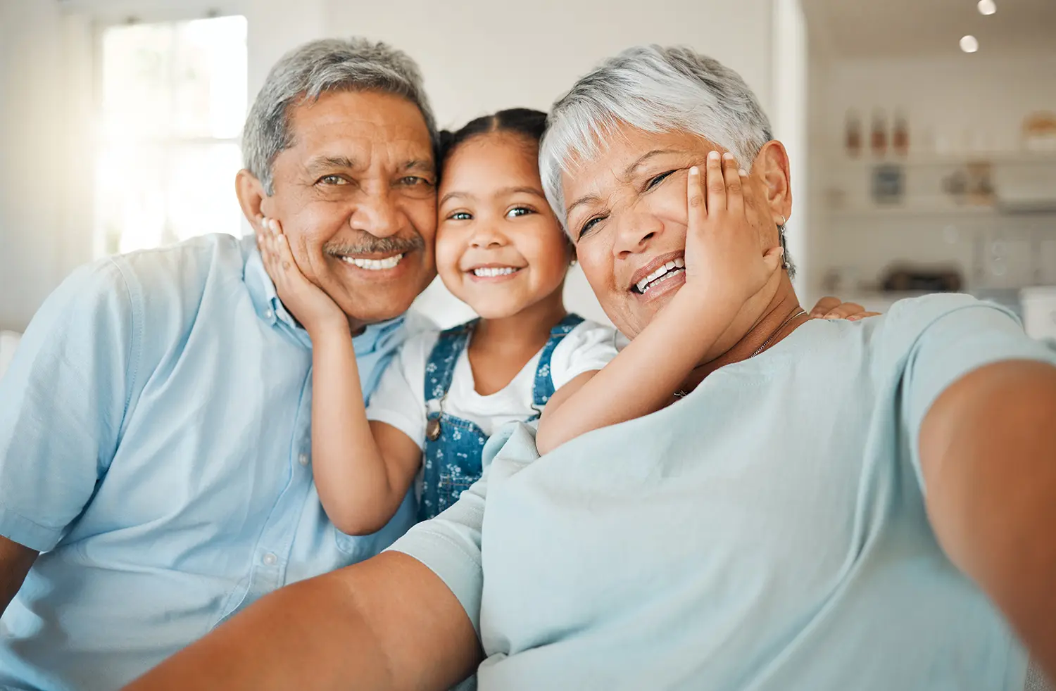 Selfie, love and grandparents with a girl, family or home with happiness, loving or relax. Portrait, old woman or elderly man with female grandchild, smile or bonding with joy, retirement or vacation.